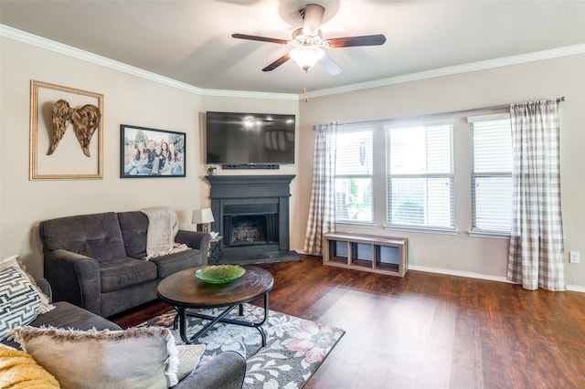 living room with dark wood-type flooring, crown molding, and ceiling fan