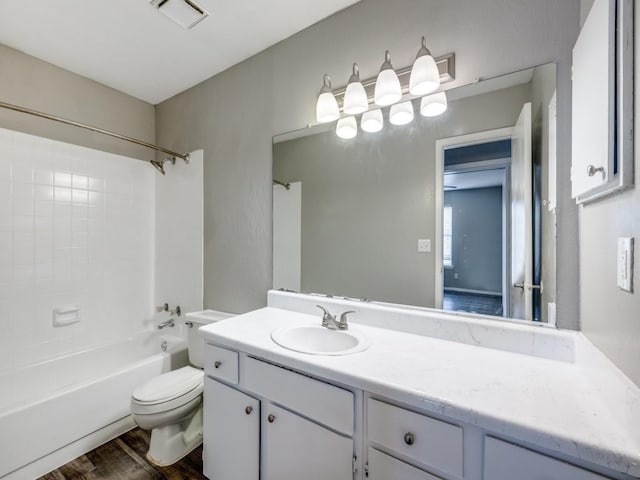 1122 Millview Dr Unit 205, Arlington, TX 76012 - bathroom with vanity,  shower combination, toilet, visible vents, and wood finished floors