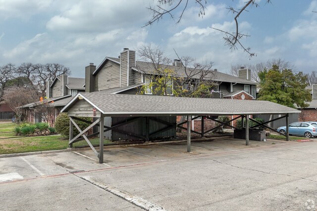 view of parking with a carport