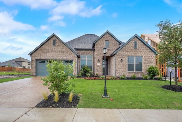 craftsman house with a garage and a front lawn