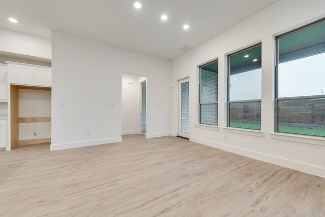 spare room featuring light hardwood / wood-style flooring