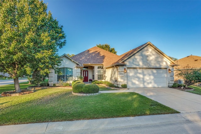 view of front facade with a front yard and a garage