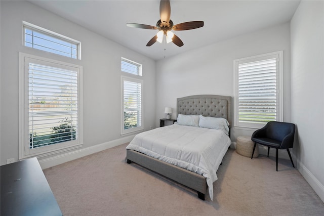 bedroom with light carpet and ceiling fan