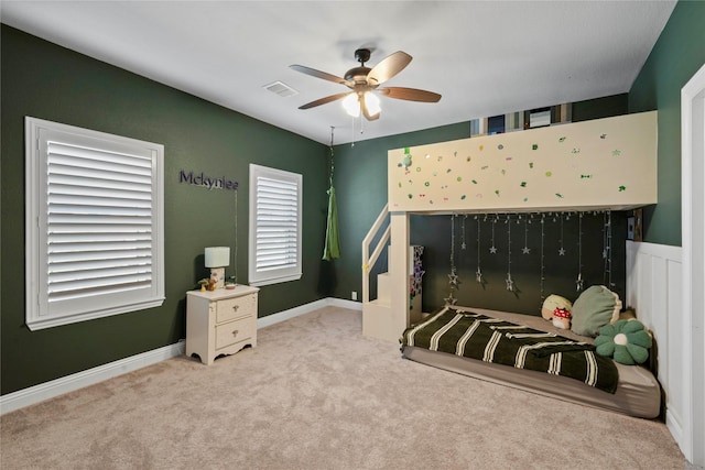 carpeted bedroom featuring ceiling fan