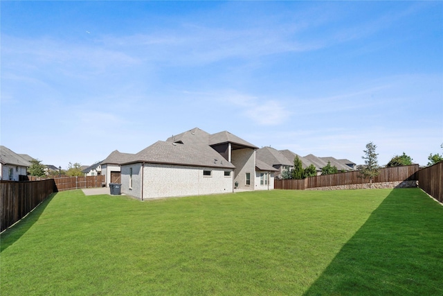 rear view of house with a lawn