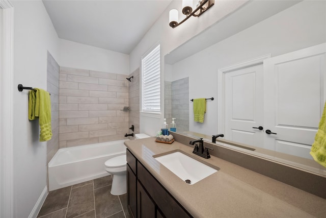 full bathroom with vanity, toilet, tile patterned floors, and tiled shower / bath