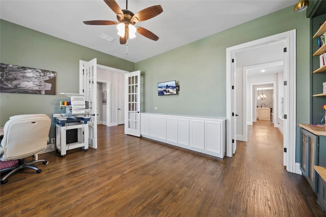 office with french doors, ceiling fan, and dark wood-type flooring