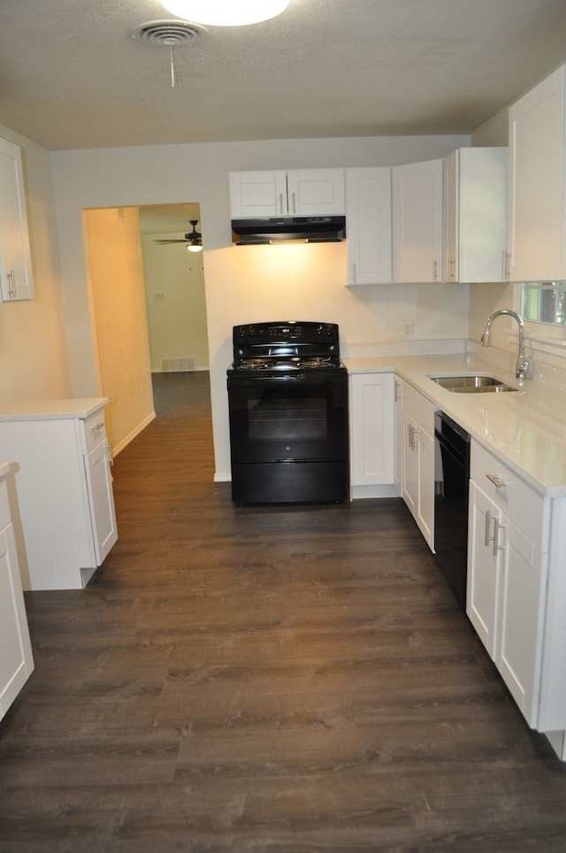 kitchen featuring sink, black appliances, white cabinets, and dark hardwood / wood-style flooring