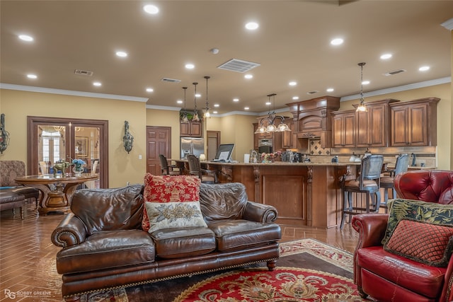 living room with ornamental molding and wood-type flooring