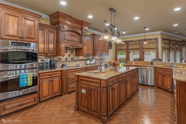 kitchen featuring a chandelier, hanging light fixtures, sink, and stainless steel appliances