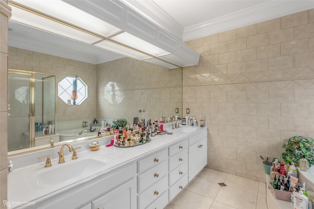 bathroom featuring shower with separate bathtub, tile patterned floors, tile walls, ornamental molding, and vanity