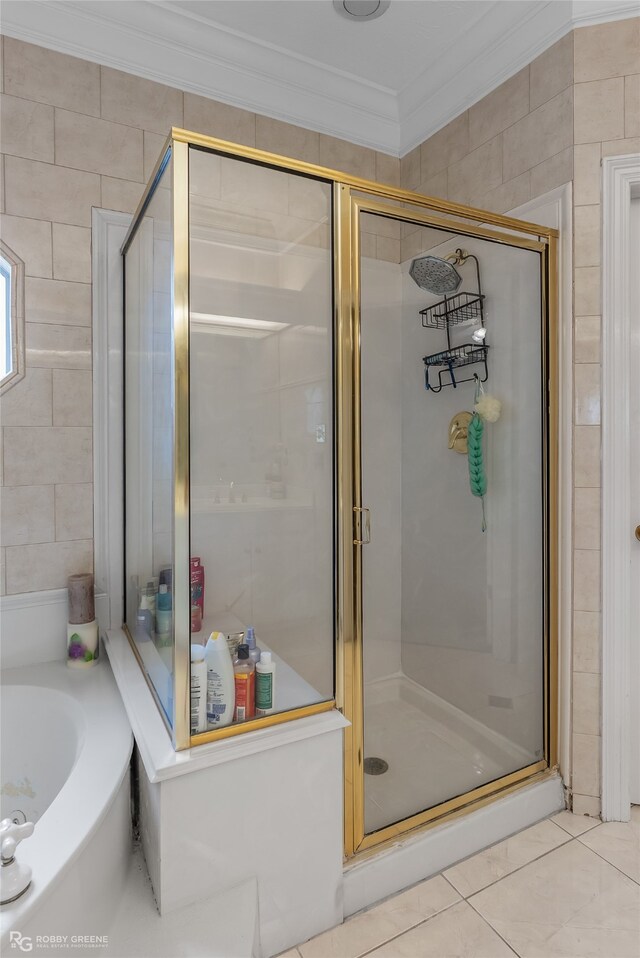 bathroom featuring ornamental molding, tile walls, and separate shower and tub