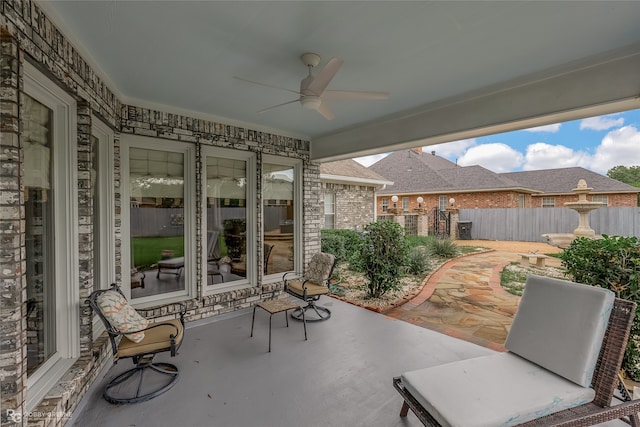 view of patio featuring ceiling fan