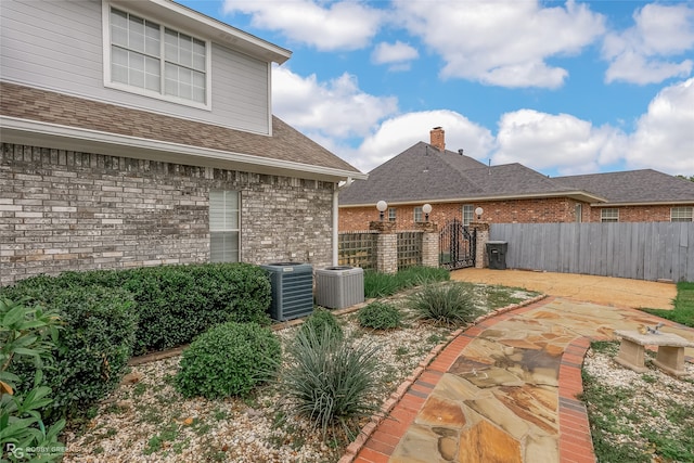 view of yard with a patio area and central AC