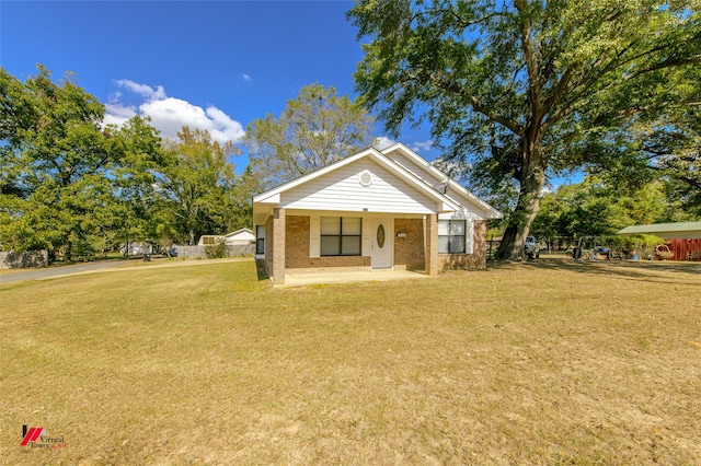 bungalow-style house with a front lawn