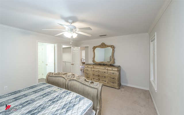 bedroom featuring ceiling fan, light carpet, and crown molding