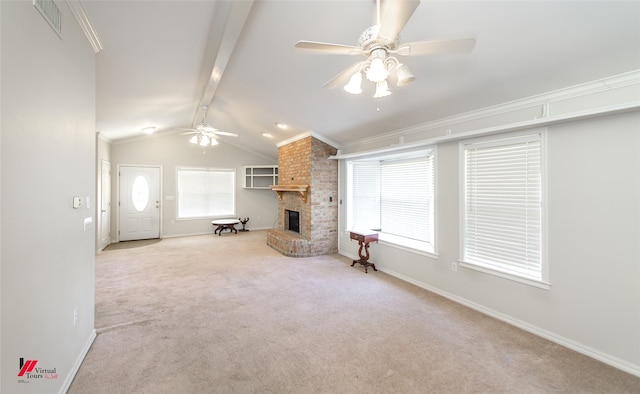 unfurnished living room with lofted ceiling with beams, light colored carpet, a fireplace, and ceiling fan