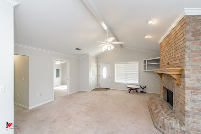 unfurnished living room with crown molding, light carpet, vaulted ceiling, and a fireplace