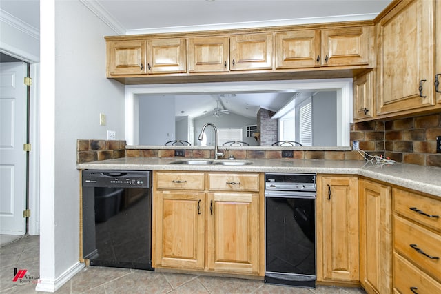 kitchen with lofted ceiling, dishwasher, ornamental molding, sink, and light tile patterned floors