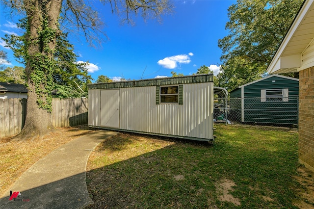 view of shed featuring fence