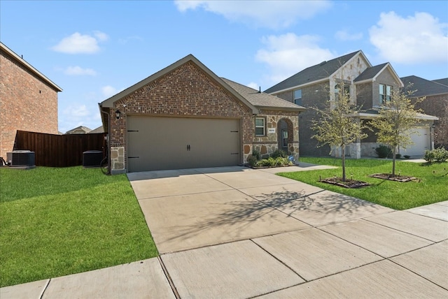 view of front of property with a front yard and a garage