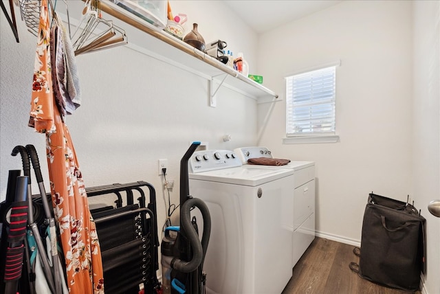 washroom with washer and clothes dryer and dark hardwood / wood-style floors