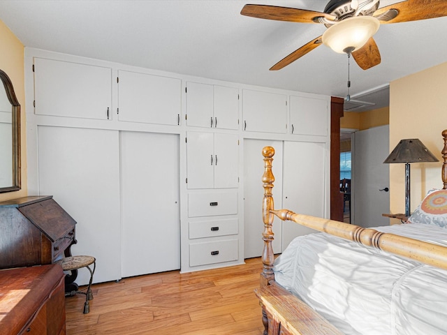 bedroom with a closet, ceiling fan, and light hardwood / wood-style flooring