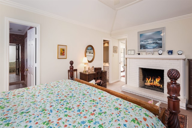 bedroom with crown molding, vaulted ceiling, and a brick fireplace