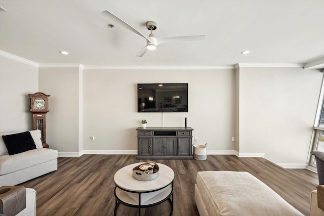 living room with dark wood finished floors, baseboards, ornamental molding, and a ceiling fan