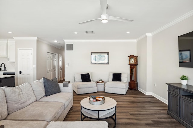 living room with ceiling fan, ornamental molding, sink, and dark hardwood / wood-style floors