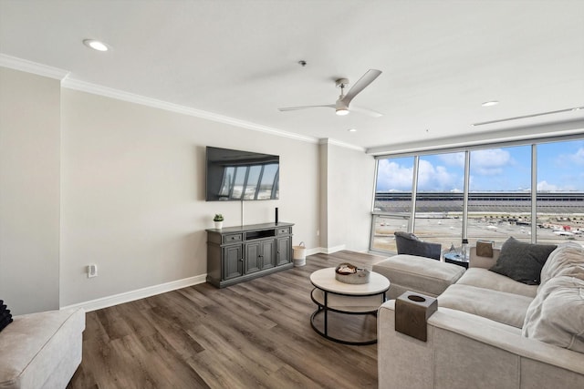 living area featuring recessed lighting, a ceiling fan, baseboards, ornamental molding, and wood finished floors