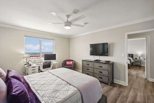 bedroom featuring ornamental molding, hardwood / wood-style floors, and ceiling fan