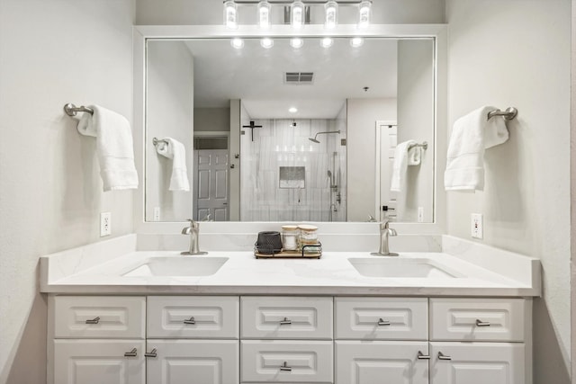 bathroom with vanity and walk in shower