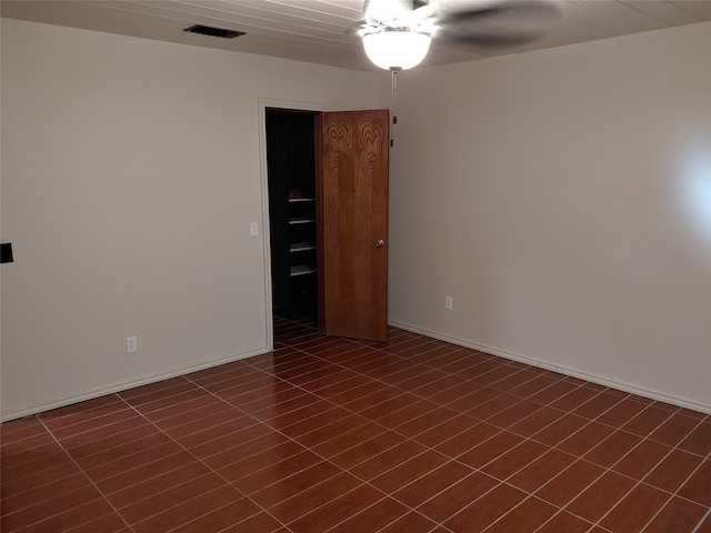 spare room with ceiling fan