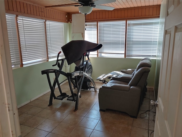 workout area featuring light tile patterned floors, wooden ceiling, and ceiling fan