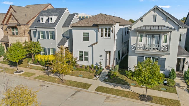 view of front of property with a balcony