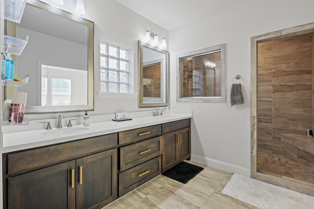 bathroom with vanity and a shower