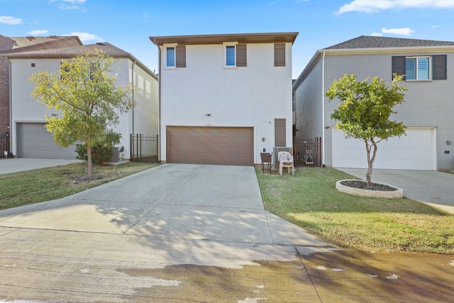 view of front of home featuring a front yard and a garage