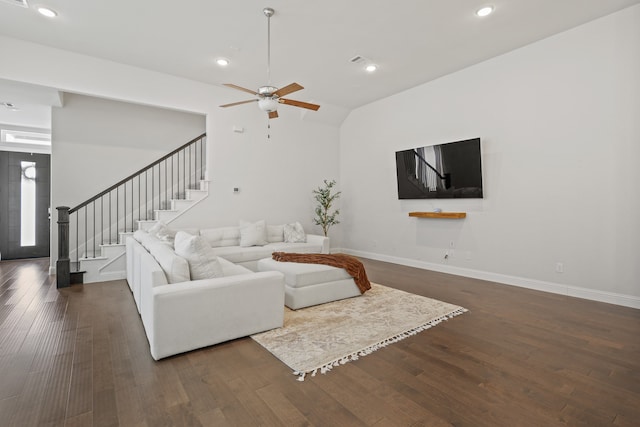 living room featuring ceiling fan and dark hardwood / wood-style flooring