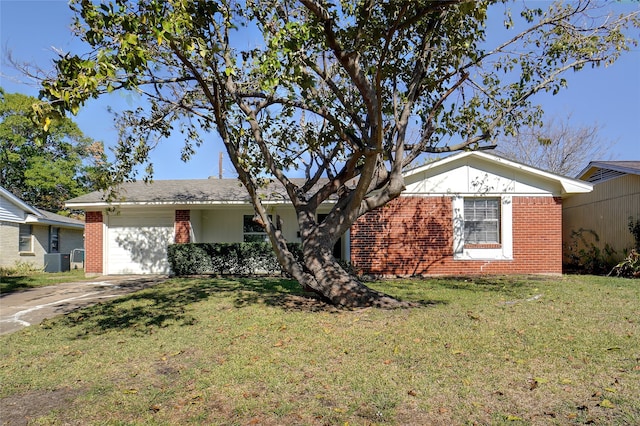 ranch-style home with a front lawn, cooling unit, and a garage