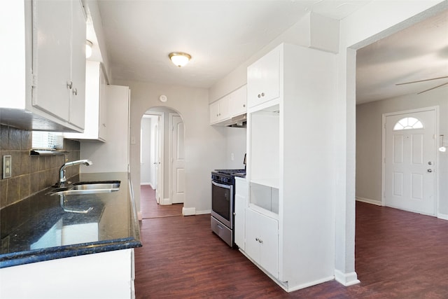 kitchen featuring white cabinets, gas stove, dark hardwood / wood-style floors, and sink