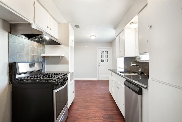 kitchen featuring dark wood-type flooring, white cabinets, sink, appliances with stainless steel finishes, and tasteful backsplash