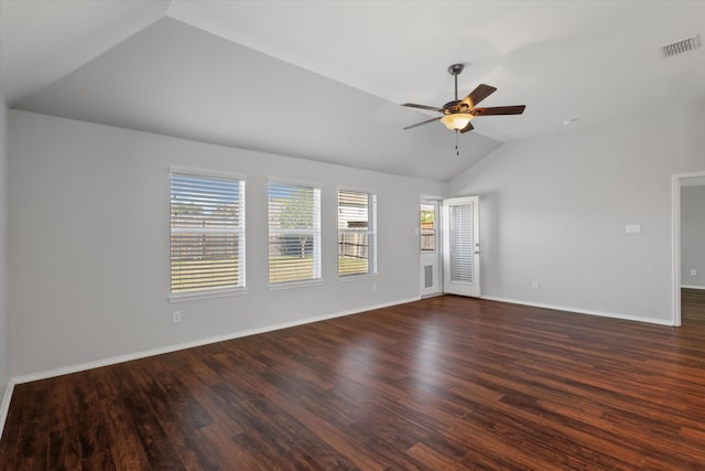 spare room featuring dark hardwood / wood-style flooring, lofted ceiling, and a wealth of natural light