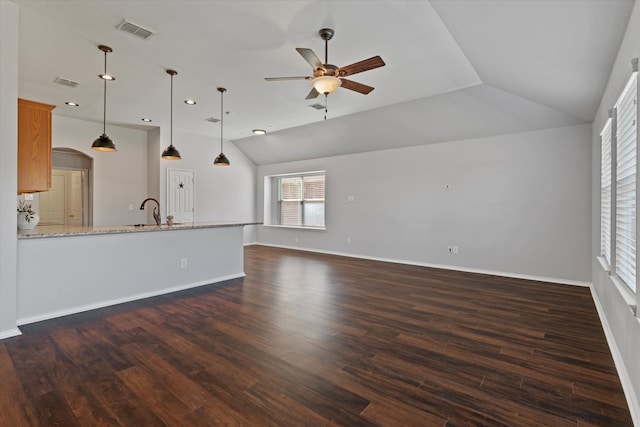 unfurnished living room with lofted ceiling, dark wood-type flooring, and ceiling fan