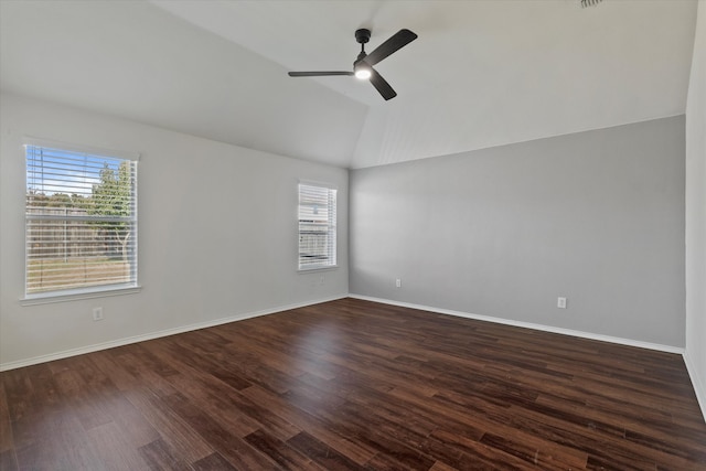 empty room with lofted ceiling, dark wood-type flooring, and ceiling fan