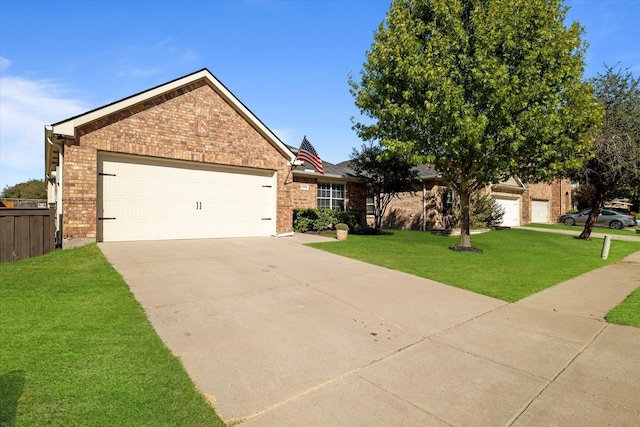 ranch-style home featuring a front lawn and a garage