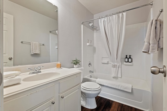 full bathroom featuring vanity, toilet, hardwood / wood-style flooring, and shower / bathtub combination with curtain