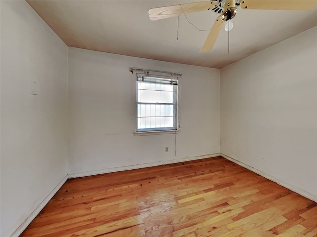 unfurnished room with light wood-type flooring and ceiling fan