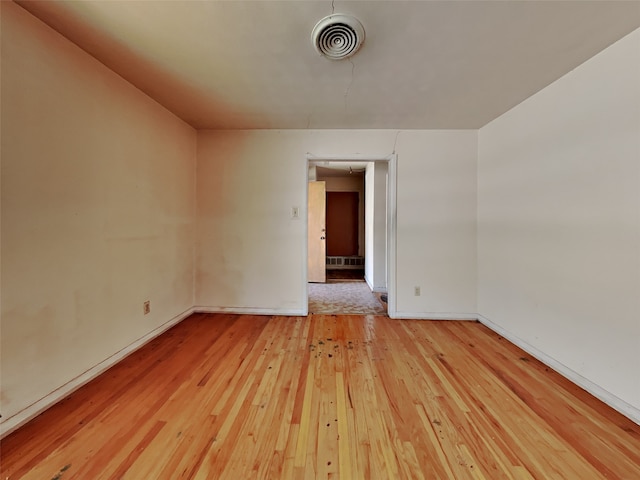 spare room featuring light hardwood / wood-style flooring