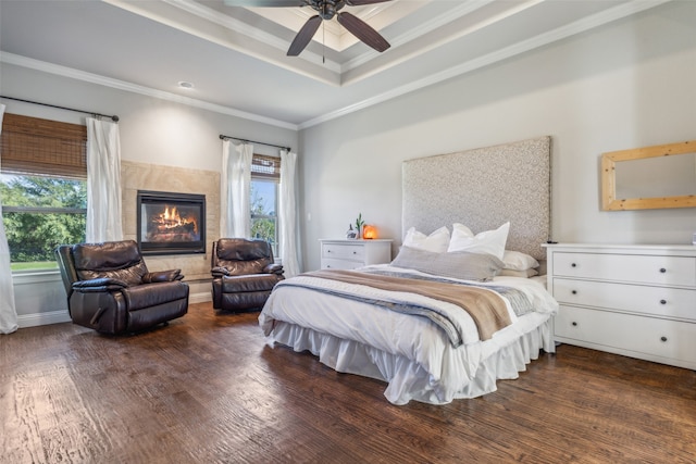 bedroom with dark hardwood / wood-style flooring, multiple windows, and ceiling fan